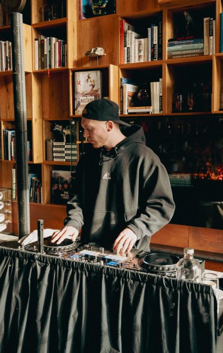 DJ mixing music at HUUS Bar & Terrace in Gstaad